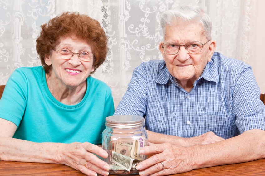 Senior Couple With Savings Jar
