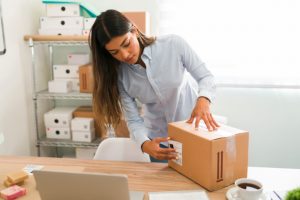 Lady putting together shipping labels