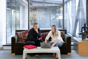 Man and woman at work in buidling