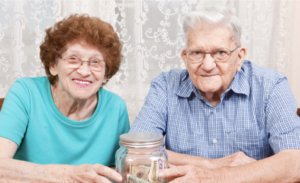 Older married couple showing joint account.