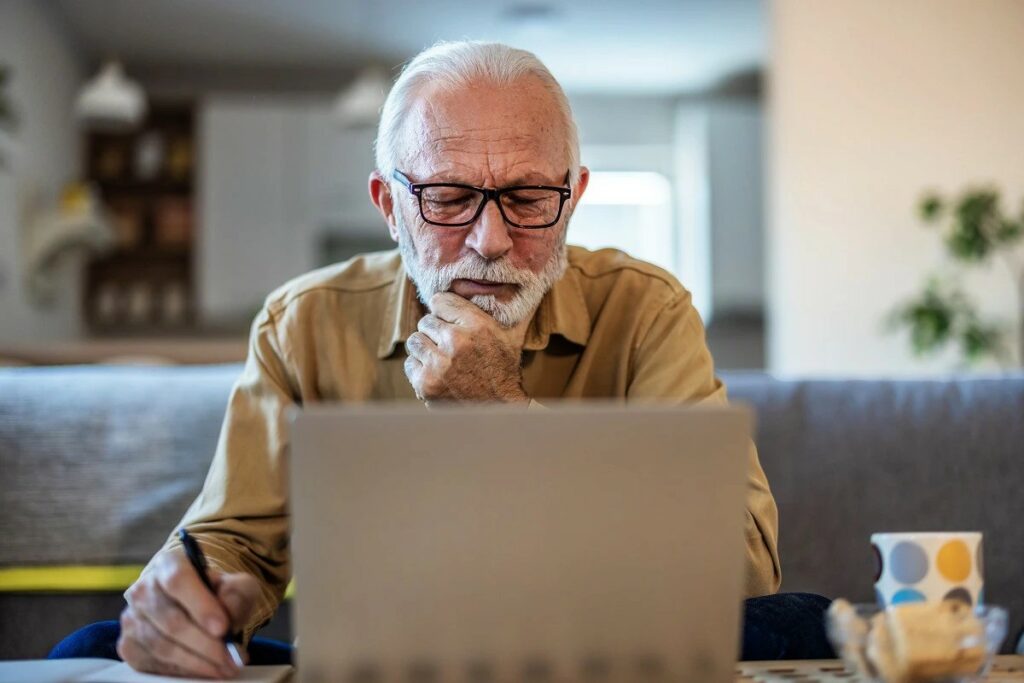 Picture of man looking at computer.