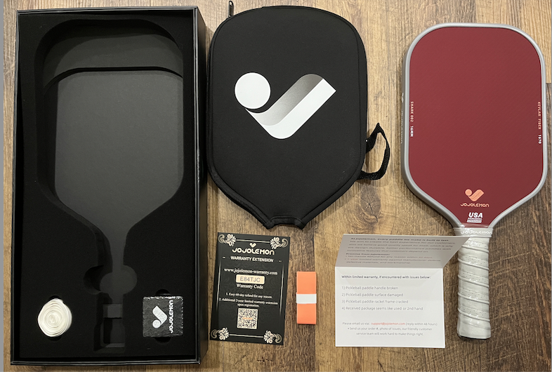Picture of JoJolemon pickleball paddle with accessories.